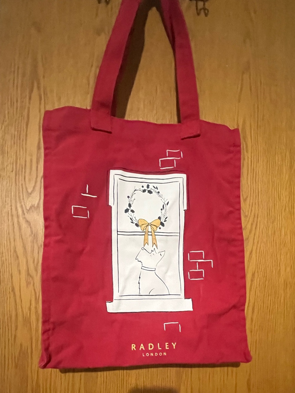 RADLEY LONDON holiday red canvas tote with window dog motif